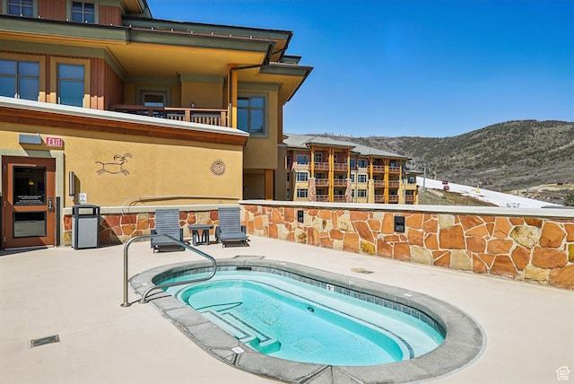 3720 N Sundial Ct Unit Cg02, Park City, UT 84098 - view of swimming pool with a mountain view and a hot tub