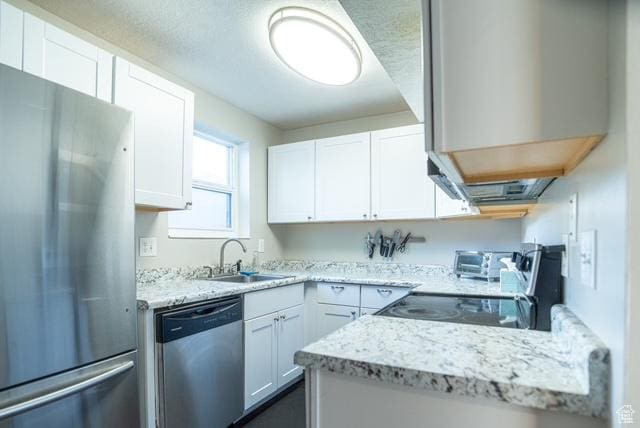 3198 S 300 E Unit 10, South Salt Lake, UT 84115 - kitchen featuring a sink, appliances with stainless steel finishes, light stone counters, and white cabinetry