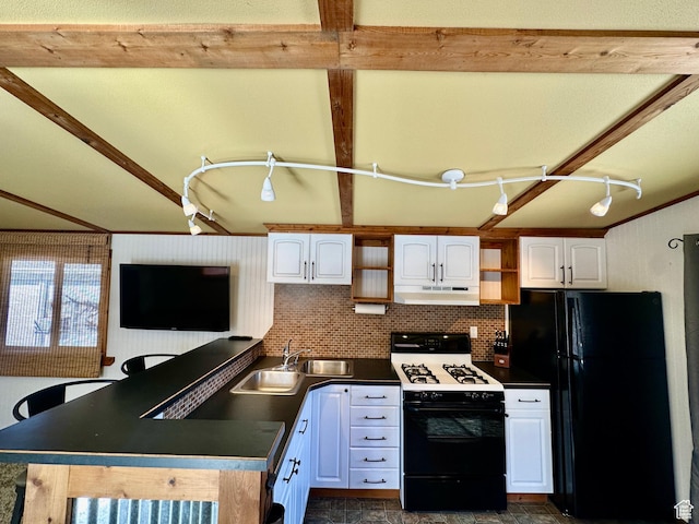 967 E Rudder St Unit 53, Garden City, UT 84028 - kitchen featuring freestanding refrigerator, white cabinetry, under cabinet range hood, gas stove, and a sink