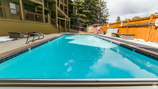 1530 Empire Ave Unit 302, Park City, UT 84060 - community pool with an outbuilding, fence, a patio area, and a storage unit