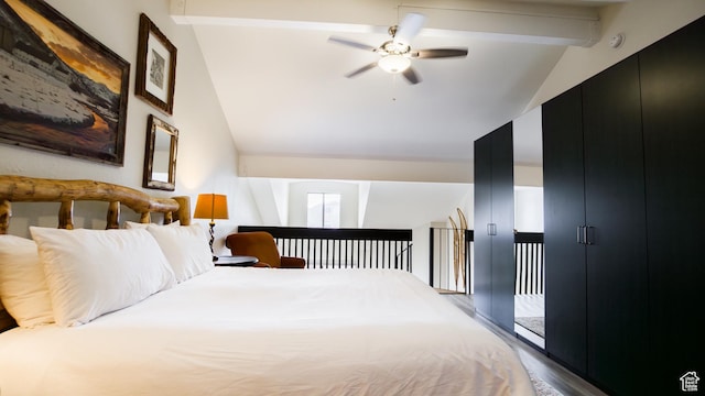 1530 Empire Ave Unit 302, Park City, UT 84060 - bedroom featuring ceiling fan, wood finished floors, and lofted ceiling with beams