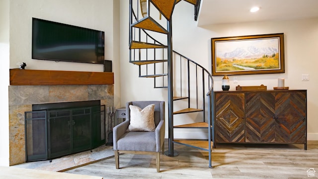 1530 Empire Ave Unit 302, Park City, UT 84060 - living area with wood finished floors, recessed lighting, a tiled fireplace, and stairway