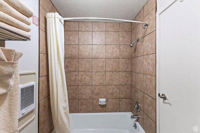 2176 S Bear Blvd, Garden City, UT 84028 - bathroom with shower / bath combo and a textured ceiling