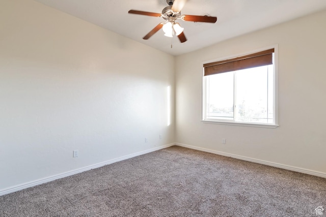 empty room featuring ceiling fan, carpet, and baseboards