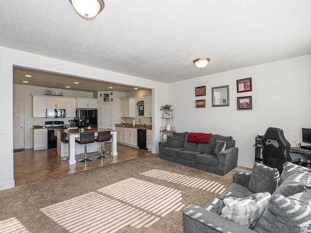 8092 W Rock Creek Cove Ln, Eagle Mountain, UT 84005 - living room with recessed lighting, baseboards, and tile patterned flooring