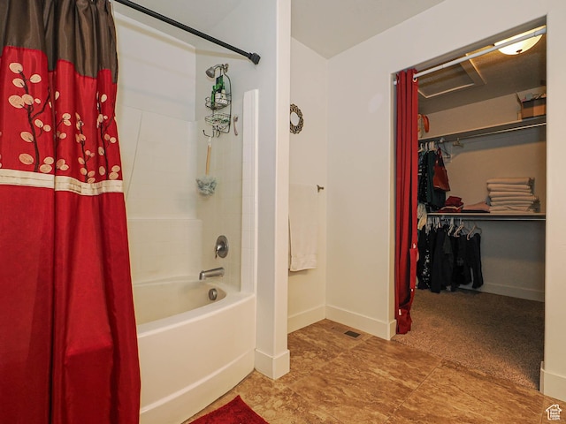 8092 W Rock Creek Cove Ln, Eagle Mountain, UT 84005 - bathroom featuring shower / tub combo with curtain, baseboards, and a walk in closet