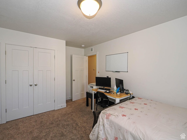 8092 W Rock Creek Cove Ln, Eagle Mountain, UT 84005 - carpeted bedroom featuring a closet, visible vents, and a textured ceiling