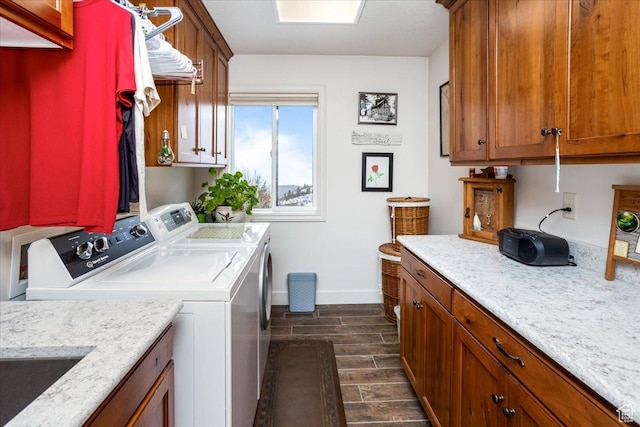 1510 S Mahogany Dr, Garden City, UT 84028 - laundry room with separate washer and dryer, baseboards, wood finish floors, and cabinet space