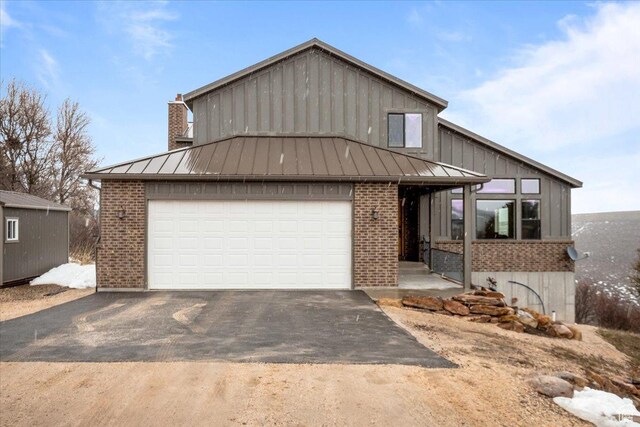 1510 S Mahogany Dr, Garden City, UT 84028 - single story home featuring a standing seam roof, metal roof, and brick siding