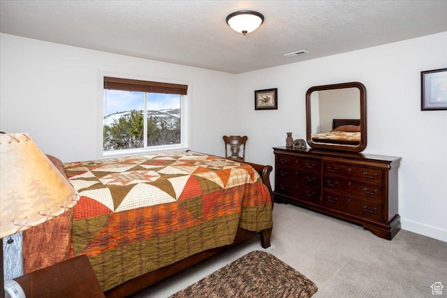 1510 S Mahogany Dr, Garden City, UT 84028 - bedroom featuring a textured ceiling, carpet flooring, and visible vents