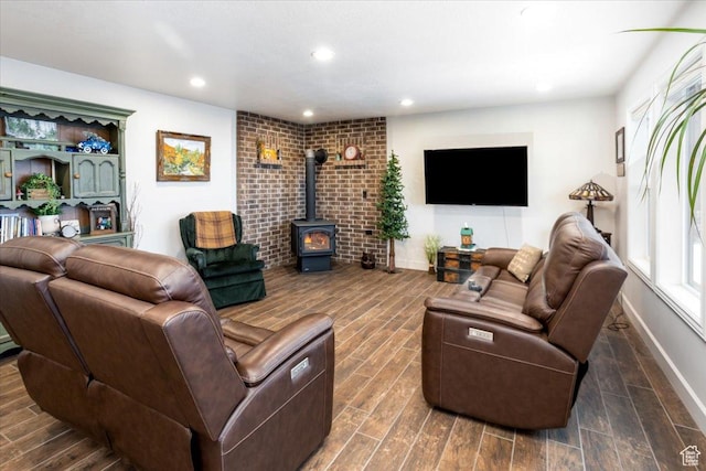 1510 S Mahogany Dr, Garden City, UT 84028 - living room featuring recessed lighting, a wood stove, baseboards, and wood finished floors