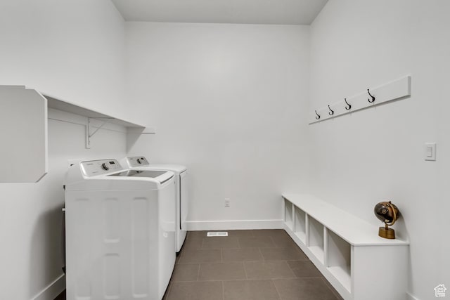 1919 S Sawmill Blvd E, Heber City, UT 84032 - washroom featuring baseboards, dark tile patterned floors, laundry area, and washing machine and clothes dryer