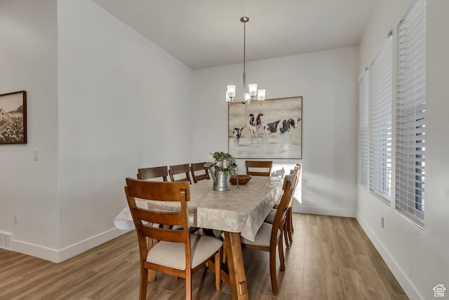 1919 S Sawmill Blvd E, Heber City, UT 84032 - dining room with a chandelier, baseboards, and wood finished floors
