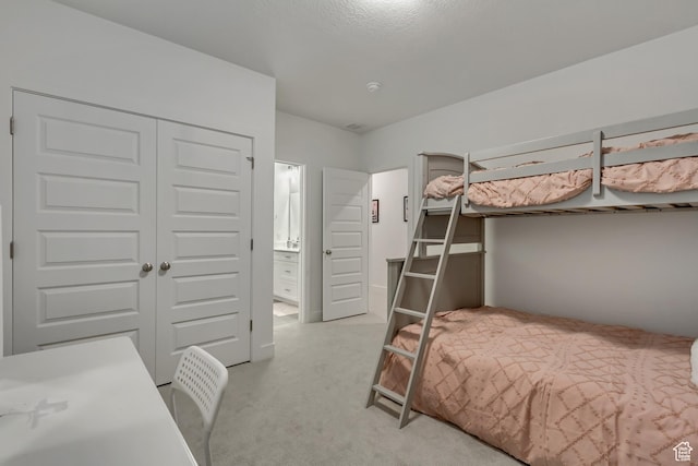 1919 S Sawmill Blvd E, Heber City, UT 84032 - bedroom featuring a closet, ensuite bathroom, and light colored carpet