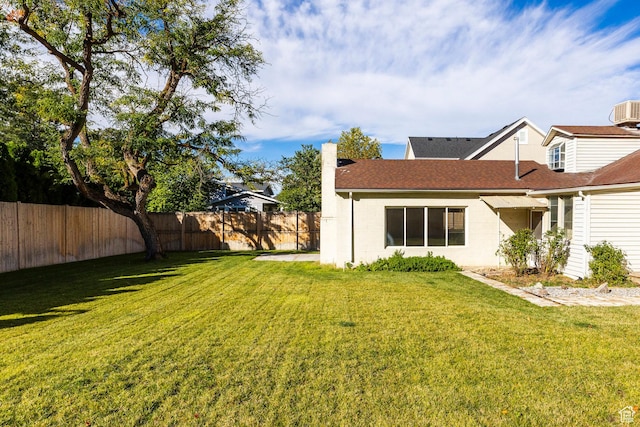 1624 E Maple Ave S, Salt Lake City, UT 84106 - back of house featuring a chimney, fence, and a lawn