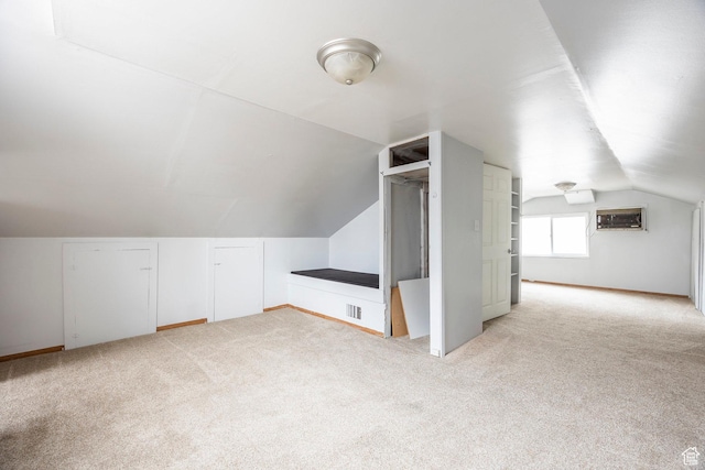 1624 E Maple Ave S, Salt Lake City, UT 84106 - additional living space featuring visible vents, a wall mounted AC, light carpet, and lofted ceiling