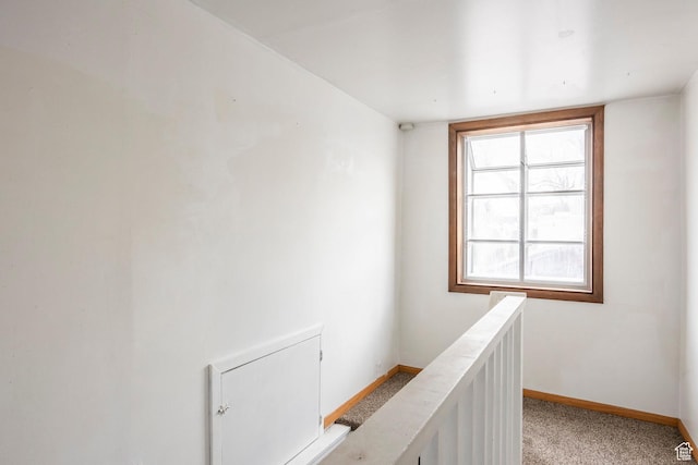 1624 E Maple Ave S, Salt Lake City, UT 84106 - hallway with baseboards, an upstairs landing, and light carpet