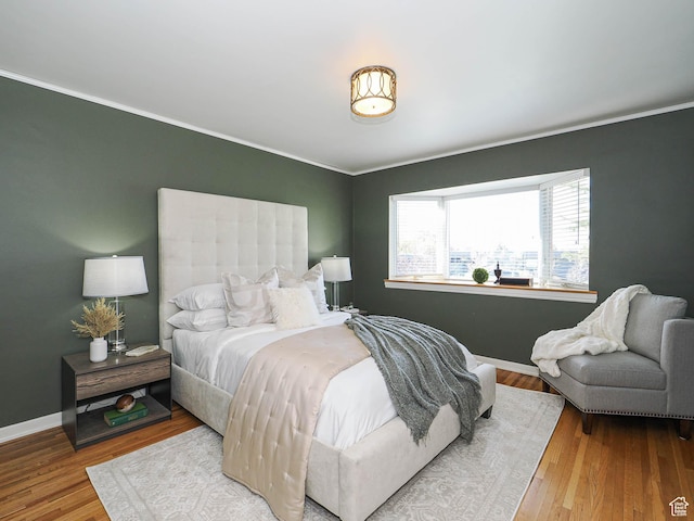 2463 E Michigan Ave S, Salt Lake City, UT 84108 - bedroom with ornamental molding, wood finished floors, and baseboards