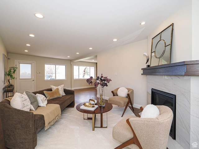 2463 E Michigan Ave S, Salt Lake City, UT 84108 - living room featuring recessed lighting, a tiled fireplace, and baseboards