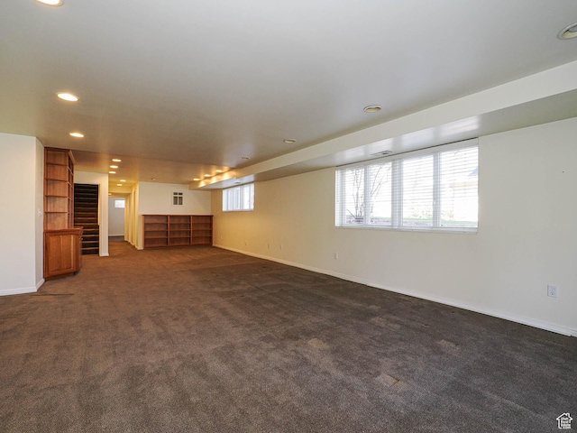 2463 E Michigan Ave S, Salt Lake City, UT 84108 - unfurnished living room featuring dark carpet, stairs, baseboards, and recessed lighting