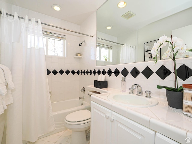 2463 E Michigan Ave S, Salt Lake City, UT 84108 - full bathroom with shower / bathtub combination with curtain, tile patterned flooring, decorative backsplash, toilet, and vanity