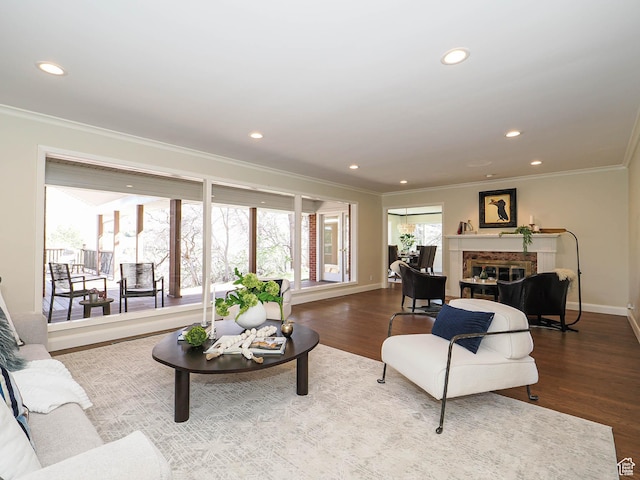 2463 E Michigan Ave S, Salt Lake City, UT 84108 - living area with ornamental molding, baseboards, wood finished floors, a glass covered fireplace, and recessed lighting