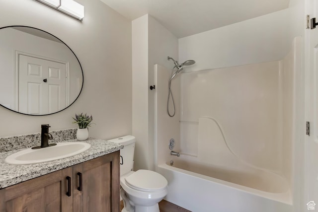 bathroom with toilet, vanity, and bathing tub / shower combination