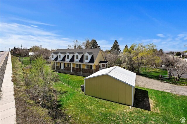 1202 E Mutton Hollow Rd, Kaysville, UT 84037 - exterior space with an outbuilding, fence, and a lawn