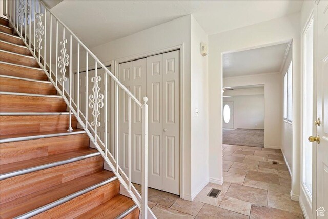 1202 E Mutton Hollow Rd, Kaysville, UT 84037 - staircase with visible vents, baseboards, and stone tile floors