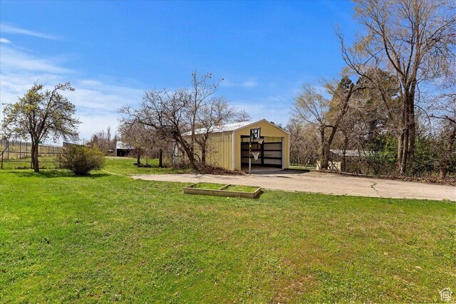 1202 E Mutton Hollow Rd, Kaysville, UT 84037 - view of yard with a pole building, an outdoor structure, a garage, and fence