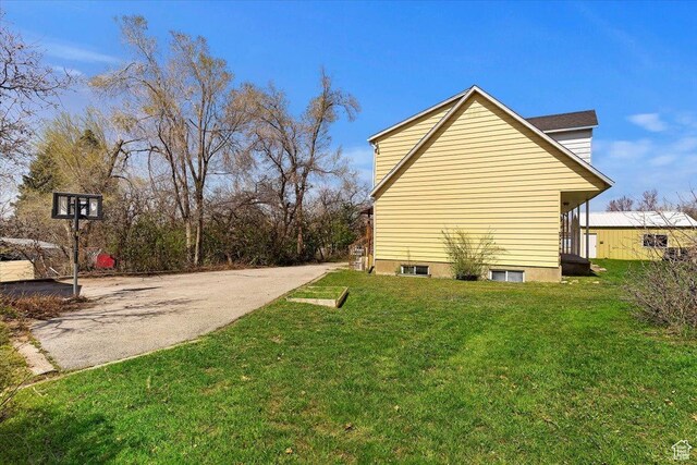 1202 E Mutton Hollow Rd, Kaysville, UT 84037 - view of property exterior featuring a lawn