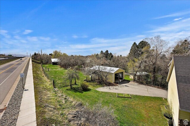 1202 E Mutton Hollow Rd, Kaysville, UT 84037 - exterior space featuring an outbuilding, a garage, and fence