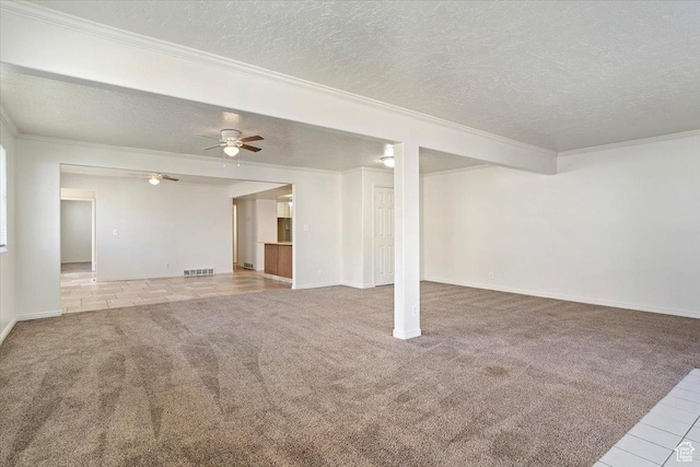 1202 E Mutton Hollow Rd, Kaysville, UT 84037 - interior space with visible vents, a ceiling fan, a textured ceiling, crown molding, and carpet flooring