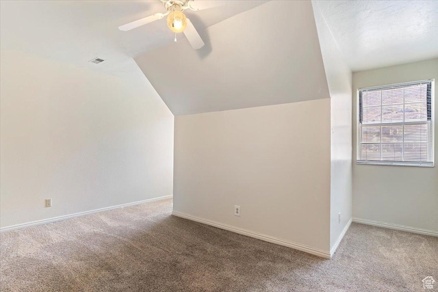 1202 E Mutton Hollow Rd, Kaysville, UT 84037 - additional living space with visible vents, baseboards, a ceiling fan, carpet, and lofted ceiling