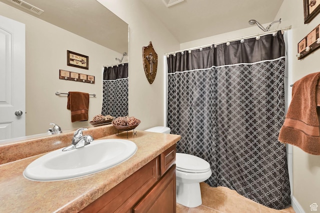 full bathroom featuring visible vents, a shower with shower curtain, toilet, vanity, and tile patterned flooring
