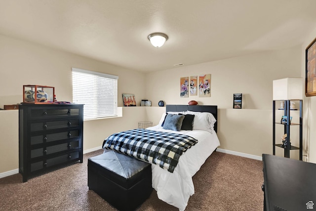 carpeted bedroom with baseboards and visible vents