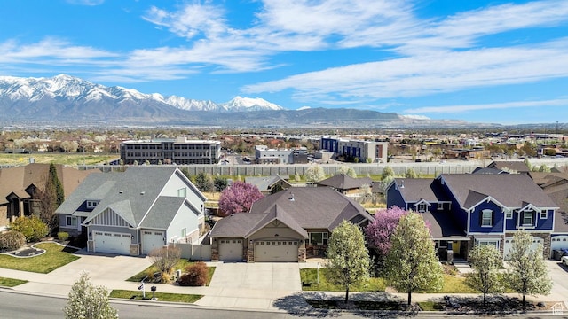 drone / aerial view with a residential view and a mountain view