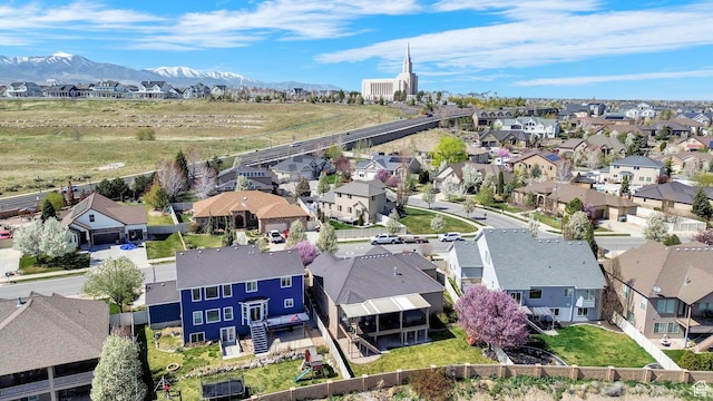 bird's eye view with a residential view and a mountain view