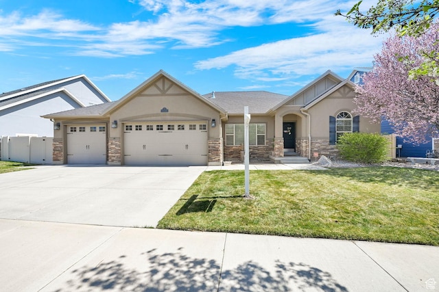 view of front of house featuring stucco siding, driveway, stone siding, a front yard, and a garage