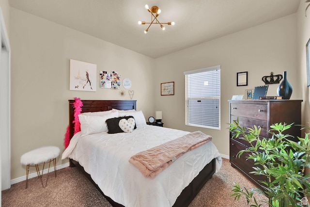 bedroom with a chandelier, baseboards, and carpet floors