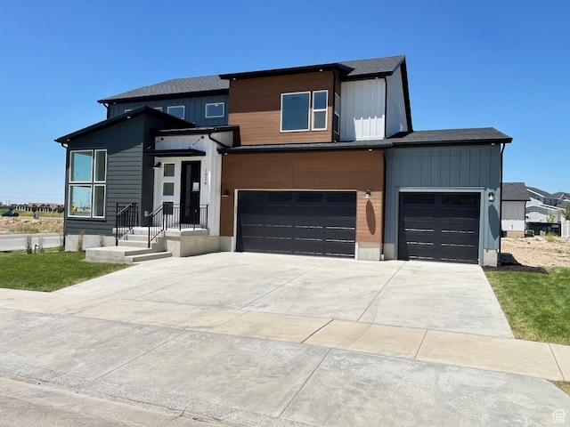 1026 W Chokecherry Dr Unit 135, Mapleton, UT 84664 - contemporary house featuring driveway, a garage, and board and batten siding