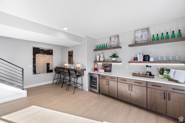 1026 W Chokecherry Dr Unit 135, Mapleton, UT 84664 - indoor dry bar featuring wine cooler, light wood-style flooring, recessed lighting, and stairway