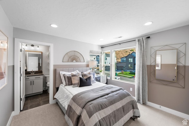 1026 W Chokecherry Dr Unit 135, Mapleton, UT 84664 - bedroom featuring carpet floors, recessed lighting, ensuite bathroom, and a textured ceiling