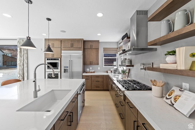 1026 W Chokecherry Dr Unit 135, Mapleton, UT 84664 - kitchen featuring wall chimney range hood, open shelves, stainless steel appliances, tasteful backsplash, and pendant lighting