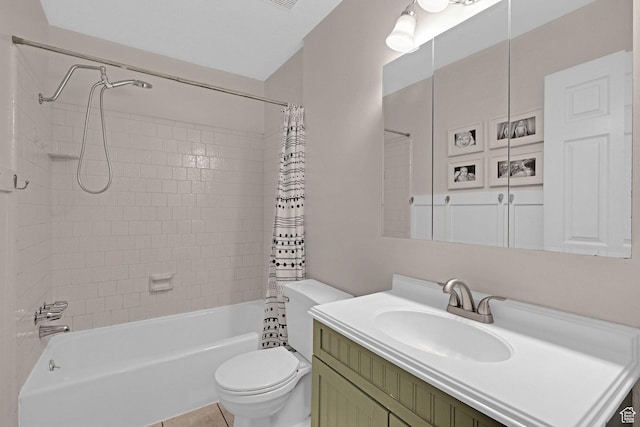 full bathroom featuring shower / bath combination with curtain, tile patterned floors, vanity, and toilet