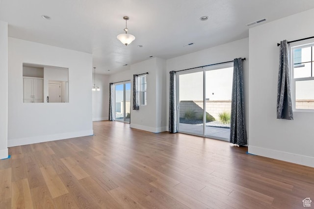 5648 S Adobe Sun Dr, St George, UT 84790 - unfurnished living room with recessed lighting, light wood-style floors, baseboards, and visible vents