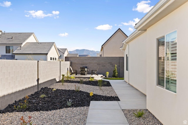 1624 W Chandler Dr, St George, UT 84770 - fenced backyard with a patio and a mountain view