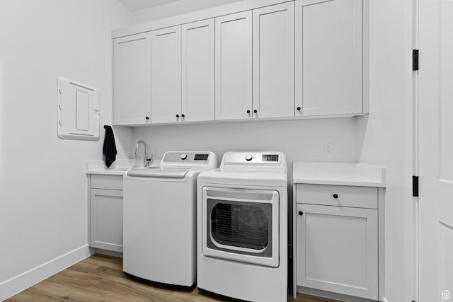 1624 W Chandler Dr, St George, UT 84770 - washroom with cabinet space, washing machine and dryer, light wood-style flooring, and electric panel