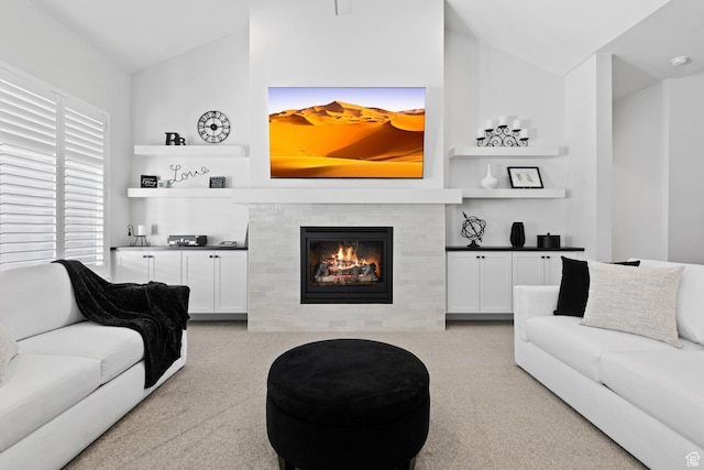 1624 W Chandler Dr, St George, UT 84770 - carpeted living area featuring vaulted ceiling, a tiled fireplace, and built in features