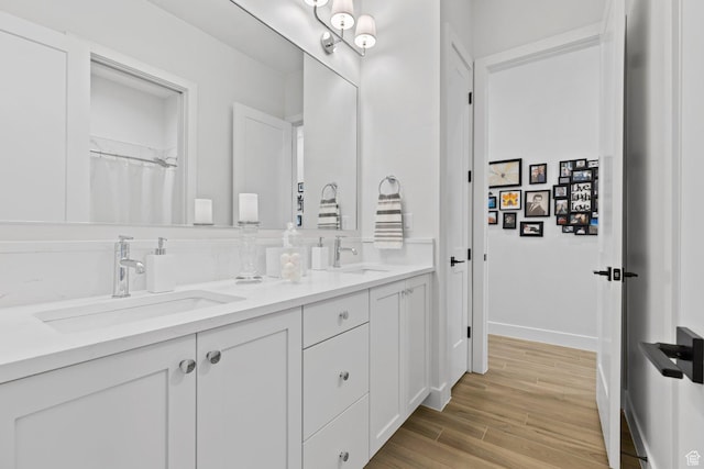 1624 W Chandler Dr, St George, UT 84770 - bathroom featuring double vanity and wood finished floors